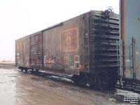 Ex-MEC boxcar converted in woodchip open-top hopper on Quebec Central system.