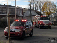 103 - 2010 Ford Escape utility and 199 - 1999 International 4900 / Superior pumper