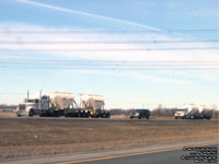 Unidentified International and Freightliner trucks