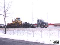 Kenworth tractor with triple rear axles